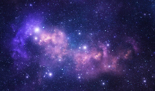 An image of a galaxy, with small and large bright stars dotting a deep, dark langscape. The colors blue and purple are present, appearing to make the galaxy look somewhat like a cloud.